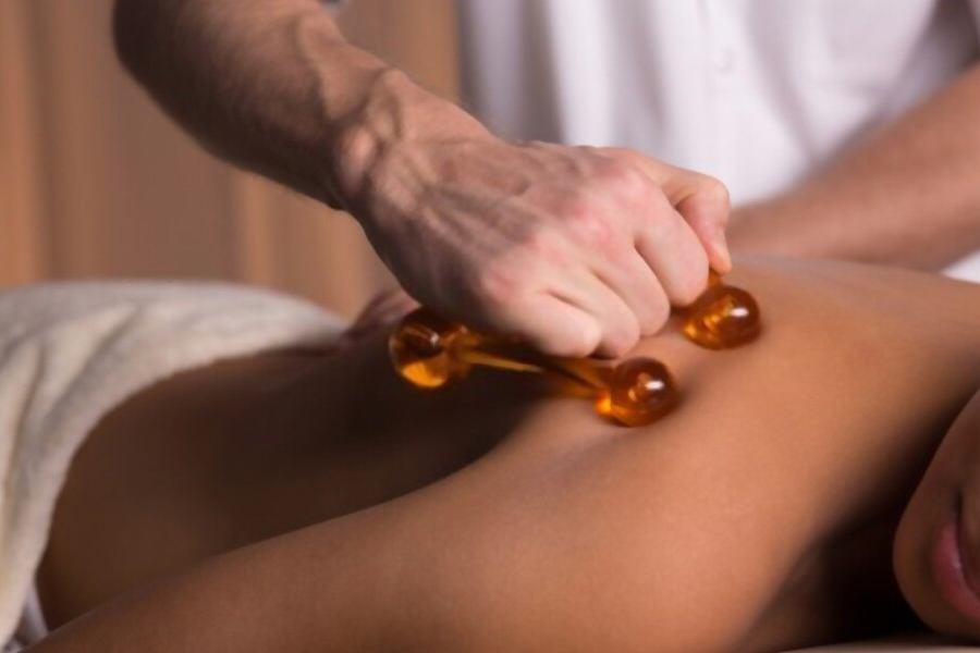 Woman getting a deep tissue massage in therapy room